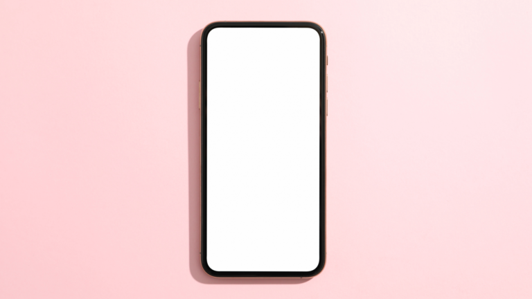 A mobile phone with a white screen on a pink background